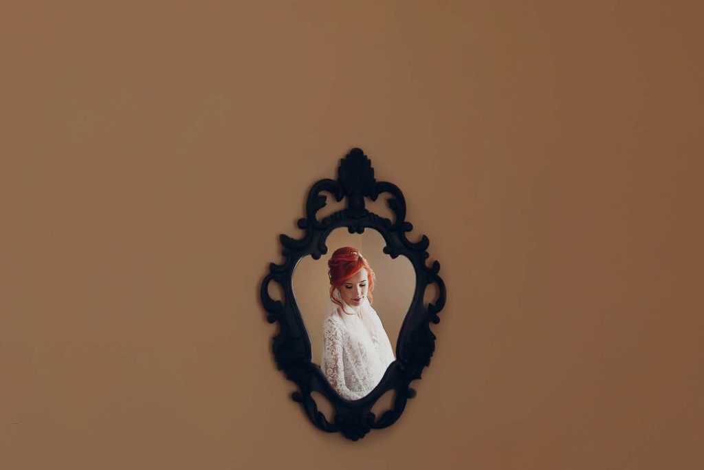 stylish-happy-bride-hand-on-luxury-wedding-dress-H8QJERP.jpg
